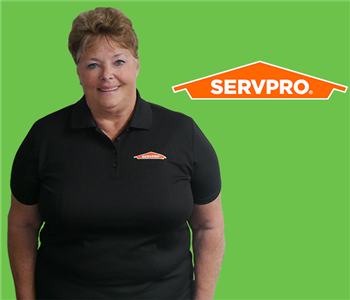 Women in front of SERVPRO Green and Logo