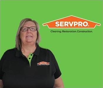 Woman in Front of SERVPRO Logo