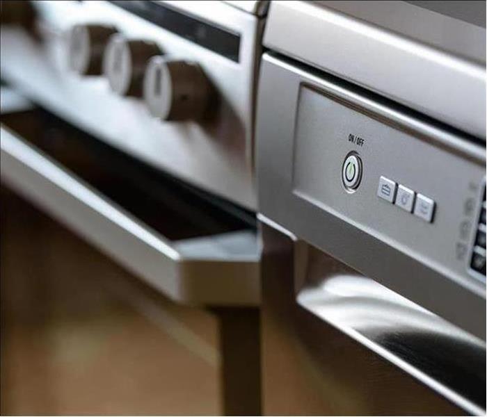 close up photo of an oven and dishwasher